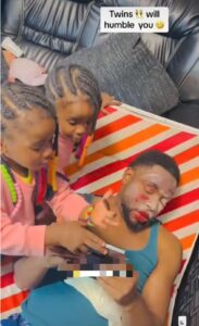 “You did a very good job” – Dad lauds twin daughters as they practice their make up skills on him