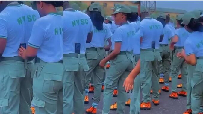 “Una don turn grown man to ring light” — Reactions as female NYSC corpers use man as a tripod stand for video